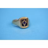 A 9ct gold Masonic flip over design ring bearing Masonic symbol to one side and monogram to reverse.