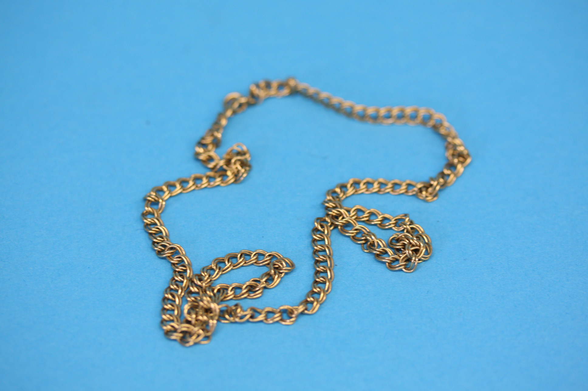 A 9ct gold necklace.  Weight 12.6 grams