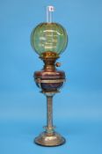 A silver plated Reid and Sons Newcastle upon Tyne oil lamp with copper reservoir and engraved silver