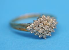 A 9ct gold cluster ring set with 25 diamonds, total approx. 0.5 carat.  Ring size R.