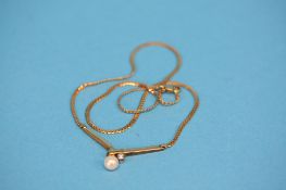 A 9ct gold pendant and chain set with cultured pearl.  Total weight 7.4 grams