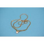 A 9ct gold pendant and chain set with cultured pearl.  Total weight 7.4 grams