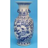 A Chinese blue and white vase decorated with birds and flowers.  43 cm high.