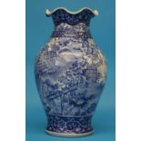 A Chinese blue and white vase with crimped rim, decorated with birds in a landscape.  37 cm high.