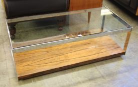 A Merrows Associates chrome and glazed rectangular coffee table.  122 cm wide x 57 cm deep