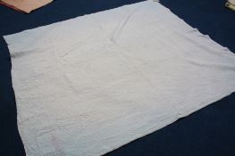 A Durham quilt with cream ground and white reverse.  204 cm x 183 cm
