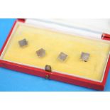 A boxed set of four 9ct gold dress studs.  Weight 4.7 grams
