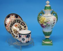 A Royal Worcester vase and cover decorated with yellow and pink roses on a white and green ground