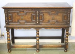 A small oak two drawer dresser base with bobbin turned legs.  114 cm wide