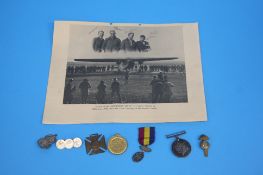 A Christmas tin 1914, containing two medals awarded to 030633 Pte. J Ferguson AOC, various other