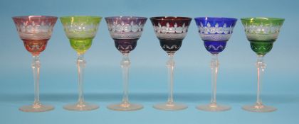 A set of 10 coloured wine glasses.