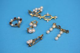 A 9ct gold floral pearl set brooch, a 9ct gold diamond brooch, two pairs of 9ct gold earrings