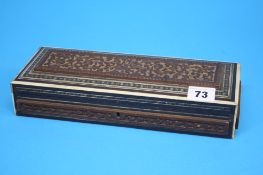 A rectangular carved wood box with rosewood travelling sewing case with marquetry decoration and