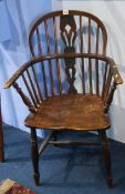 A stick back Windsor chair.