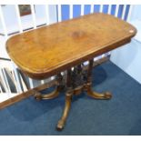 A Victorian walnut fold over card table with quarter marquetry top and green baize, supported on