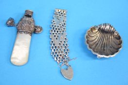 A mother of pearl Babies rattle with silver mount, Birmingham 1897, George Unite, a small shell