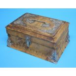 A leather jewellery casket with applied silver coloured mounts.