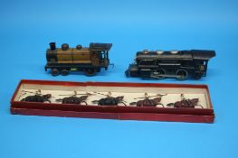 A boxed set of Britains soldiers on horseback, a French clockwork tinplate loco and a Lionel O gauge