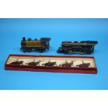 A boxed set of Britains soldiers on horseback, a French clockwork tinplate loco and a Lionel O gauge