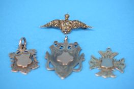 A 1940's silver marcasite RAF brooch, 2 silver fobs and a Persian silver fob. (4)