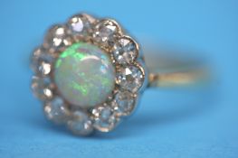 An Antique 18ct gold opal and diamond ring.