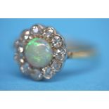 An Antique 18ct gold opal and diamond ring.