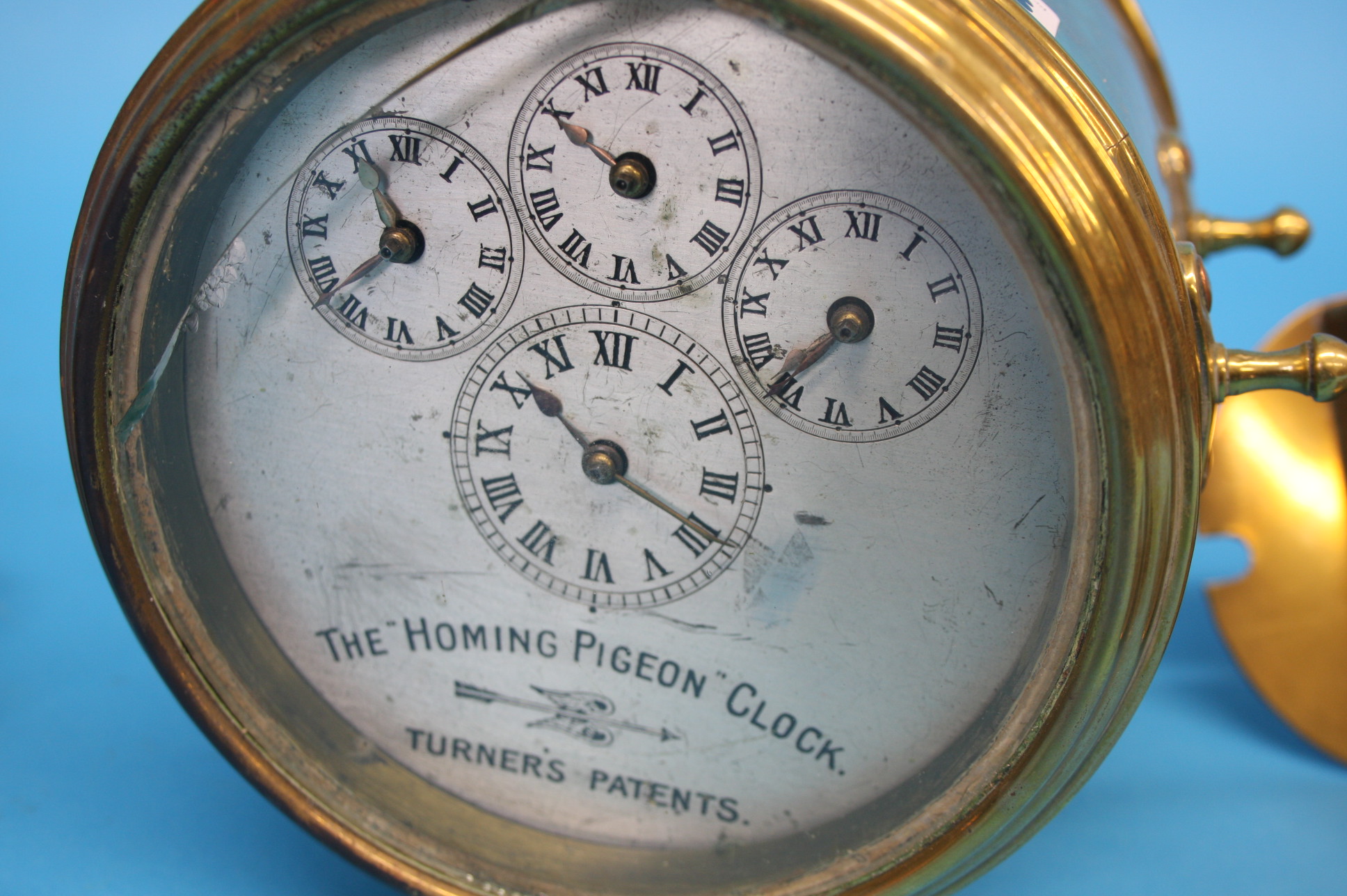 A Hateley's "Turners Patent" "The Homing Pigeon Clock" in a brass case, silvered dial; and a pair of - Image 2 of 3