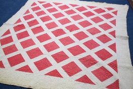 A Durham quilt with white ground and red squares, with red reverse.  230 cm x 205 cm