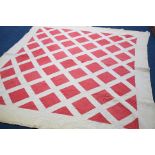 A Durham quilt with white ground and red squares, with red reverse.  230 cm x 205 cm