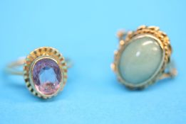 Two 9ct gold rings, one amethyst set, the other with oval green jade.  Ring size N and M.