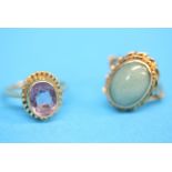 Two 9ct gold rings, one amethyst set, the other with oval green jade.  Ring size N and M.