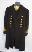 A Naval Officer's suit to include tunic, waistcoat, trousers, sash etc.