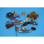 A yellow metal fob with greyhound, two other fobs, seven silver brooches and seven brooches,
