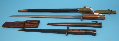 A British World War I bayonet and scabbard and one other (possibly Russian)