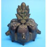 A late 19th / early 20th century bronze Indian spice sensor with six decorative lidded compartments.