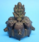 A late 19th / early 20th century bronze Indian spice sensor with six decorative lidded compartments.