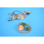 A gold coloured brooch set with carved coral rosehead and jade leaves and a 1920's marcasite and
