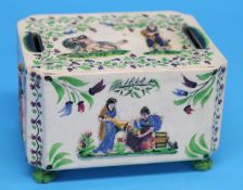 A Victorian pottery money box, each end decorated with cricketing batsmen, the top, front and back