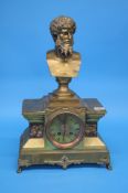 A 19th century brass mantle clock surmounted by a bust of a classical god below brass dial, 8 day