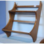 A small Ercol Golden Dawn two tier shelf.  43 cm wide