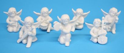 A set of seven Rosenthal classic bisque porcelain angel musicians and four Chinese Canton enamel
