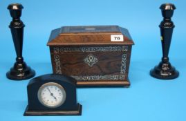 A Victorian Rosewood tea caddy with mother of pearl banding and an ebonised clock garniture.  22