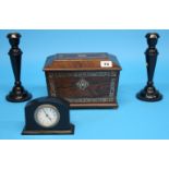 A Victorian Rosewood tea caddy with mother of pearl banding and an ebonised clock garniture.  22