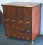 A Victorian mahogany fold over commode supported on turned feet.  66 cm wide