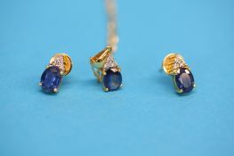 An 18ct gold sapphire and diamond pendant chain and a matching pair of earrings.