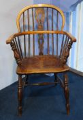 A stick back Windsor chair.