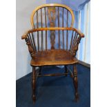 A stick back Windsor chair.