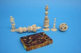 A small tortoiseshell calling card case and a quantity of carved ivory including a small