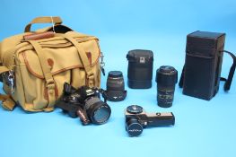 A Pentax ist D camera with Tamron AF Aspherical XR Di 28-300mm lense, a Sigma lense 20mm 1:1.8 Ex DG