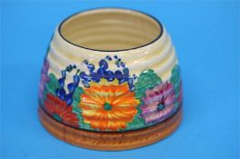 A Clarice Cliff Bizarre 'Gayday' pattern beehive shape honey pot (no cover), black printed mark.